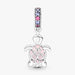 A charming pink turtle with purple stones, ideal for adding a whimsical touch to any jewelry collection.
