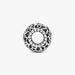A sleek silver ring adorned with a striking black and white pattern, highlighting its contemporary style.