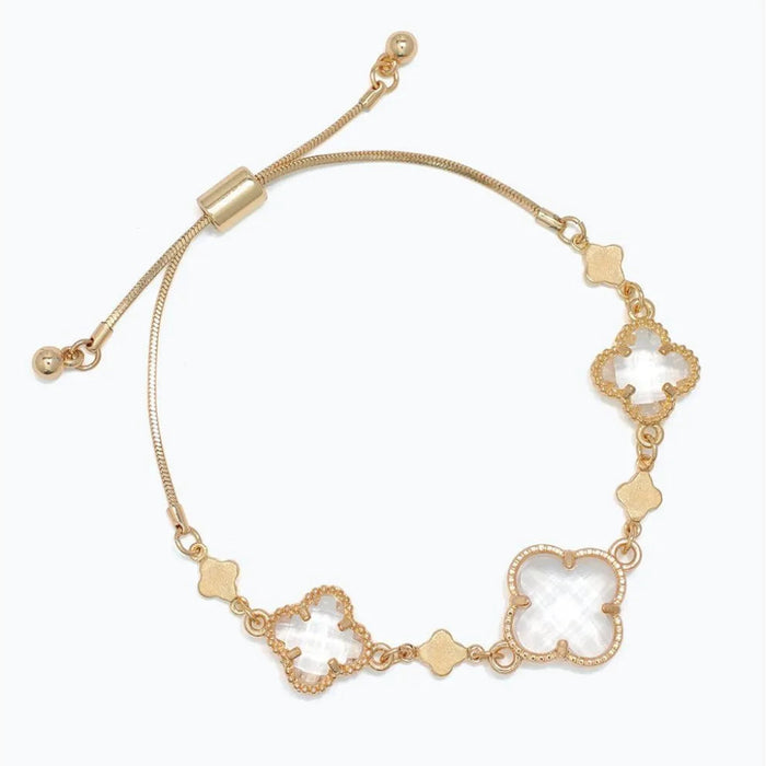 gold bracelet featuring clover accents with faceted clear crystals for a sparkling and elegant look.