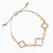 gold bracelet featuring clover accents with faceted clear crystals for a sparkling and elegant look.
