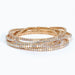 White beaded stretch bracelet featuring six strands of clear and milky white crystal beads arranged in a layered design for an elegant everyday look.