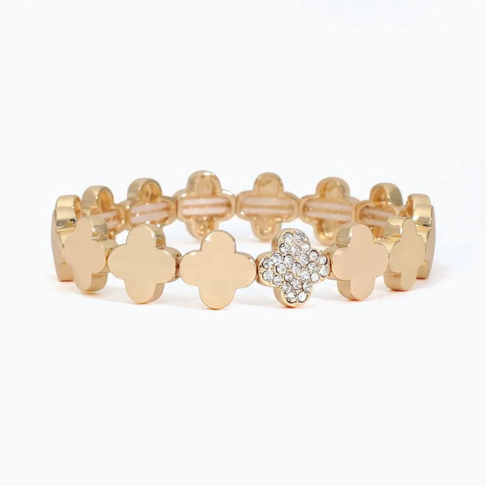 Periwinkle linked gold clover bracelet featuring sparkling pave accents and an elegant repeating design.