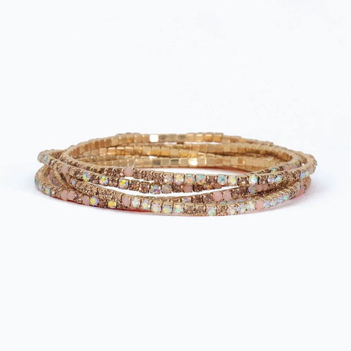 Periwinkle bracelet with six strands of blush, champagne, and AB crystals in a sparkling layered design.