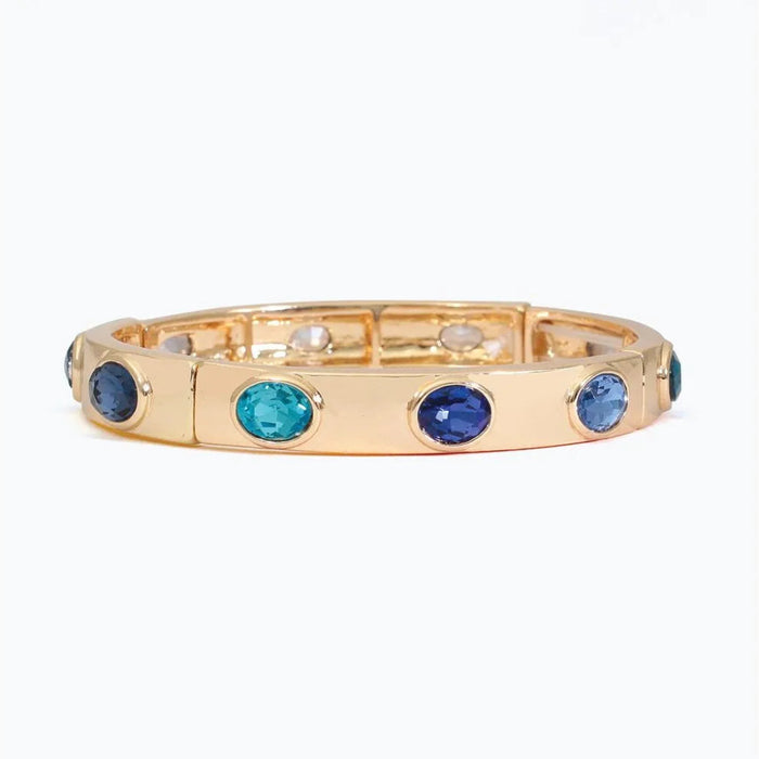 Periwinkle gold bracelet featuring sparkling royal blue and aqua crystals in an elegant colorful design.