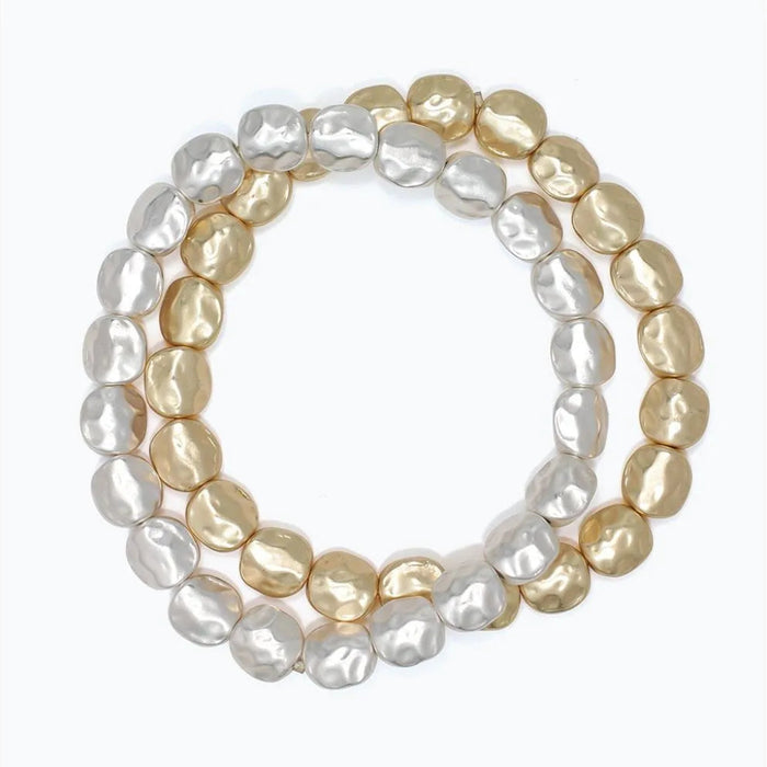 Periwinkle two-strand bracelet featuring hammered matte silver and gold-tone accents.
