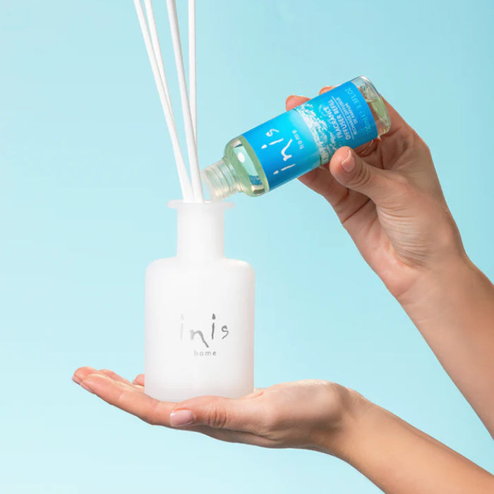This elegant reed diffuser continuously releases the signature Inis fragrance, creating a clean, uplifting atmosphere without the need for flames or electricity.
