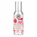 Michel Design Works Peppermint scented room spray in a silver bottle with a tall silver cap and a festive label featuring red ornaments, striped candy canes, and pink ribbon.
