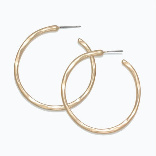 Periwinkle hammered matte gold hoop earrings with a textured finish and classic circular design