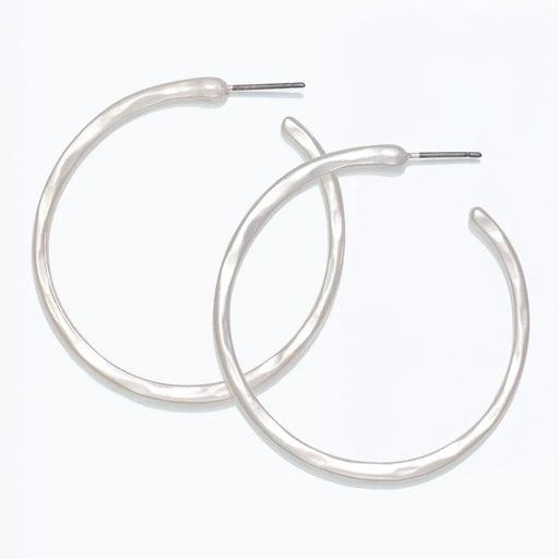 Periwinkle hammered silver hoop earrings with a textured matte finish and classic circular design.