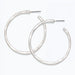Periwinkle hammered silver hoop earrings with a textured matte finish and classic circular design.