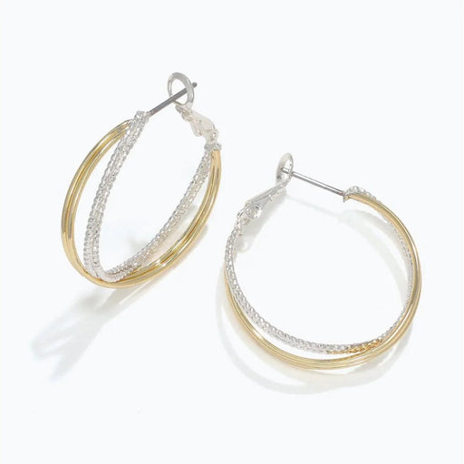 Periwinkle two-tone twisted hoop earrings featuring an elegant intertwined design with contrasting metal finishes.