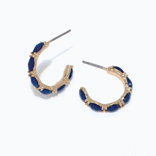 Periwinkle gold hoop earrings with faceted navy accents and a polished, elegant design.