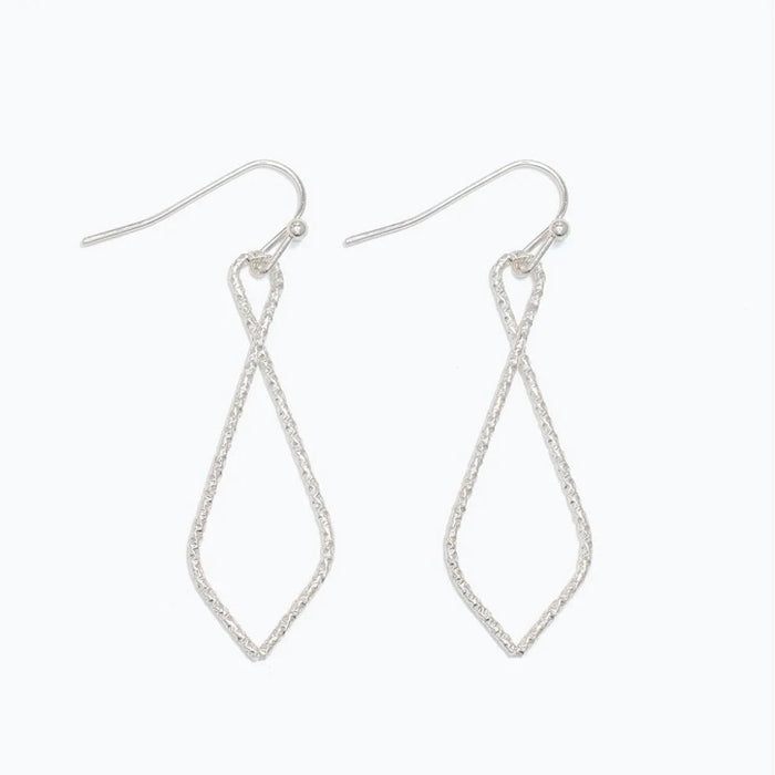 The sculpted open-drop silhouette adds graceful dimension without overwhelming your look.