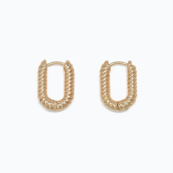 Periwinkle chic ribbed gold huggie earrings with a textured finish and compact hoop design