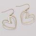 This Burnished Two Tone Hearts Earring by Periwinkle features a charming heart design with a beautiful blend of burnished silver and gold-tone finishes.