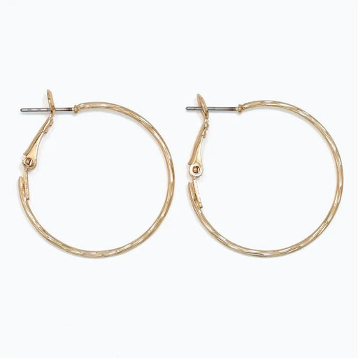 Periwinkle delicately textured gold hoop earrings with a classic silhouette and refined finish