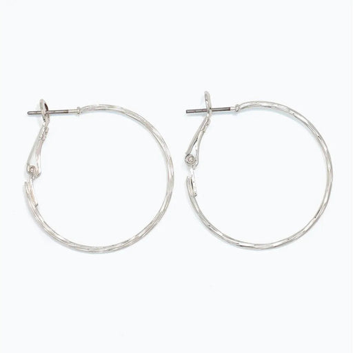 Periwinkle delicately textured silver hoop earrings with a classic silhouette and refined finish
