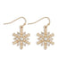 These Periwinkle Gold Snowflakes with Crystal Inset Earrings features a warm gold-tone snowflake with sparkling crystal insets. 