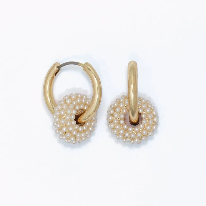 Pearl studded rondelle huggie earrings with an elegant compact hoop design