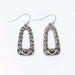 Open silver filigree drop earrings featuring an intricate openwork design