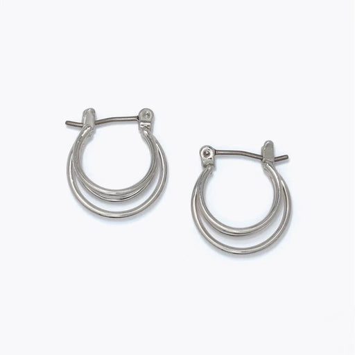 Delicate silver ring hoop earrings featuring a simple polished circular design