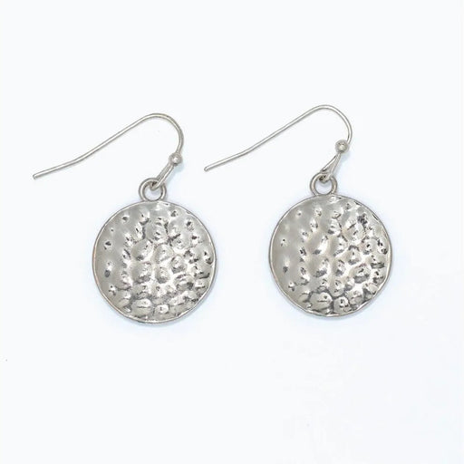 Hammered silver circle earrings featuring a textured finish and classic round design