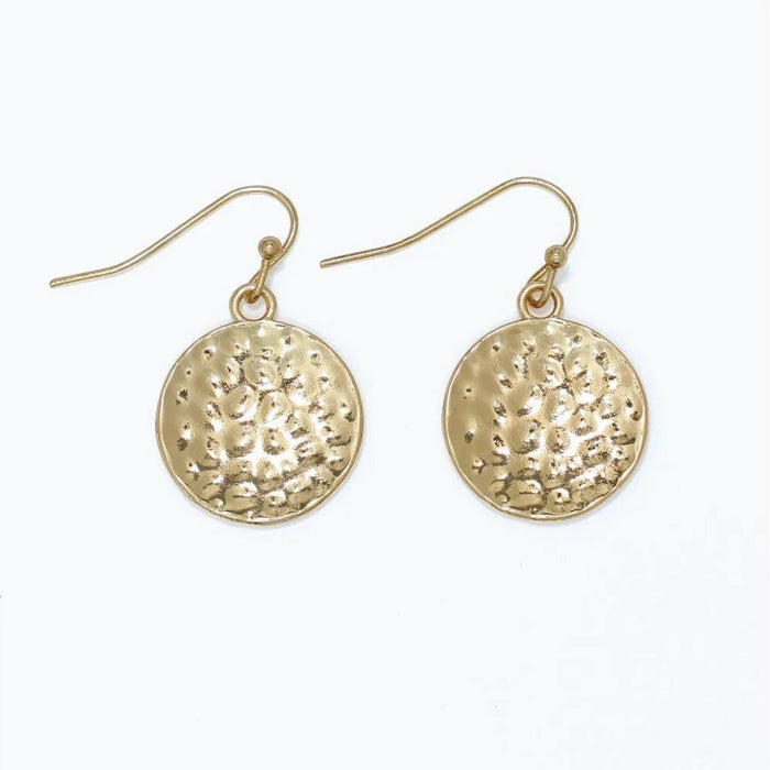 Hammered gold circle earrings featuring a textured finish and classic round design
