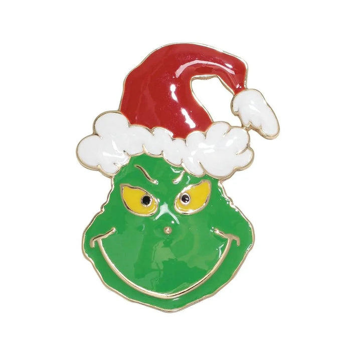 The Periwinkle Enamel Grumpy Green Christmas Pin, featuring a playful green enamel design perfect for festive holiday outfits