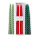 Set of green and red twisted candles with a white box in the center.