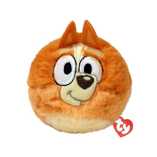 A stuffed animal featuring an orange face and eyes, showcasing a playful and cheerful expression.
