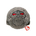 A soft plush toy featuring a friendly robot face with large eyes and a smiling mouth.