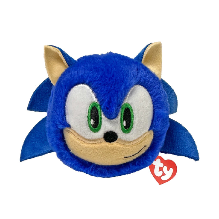 Plush Sonic the Hedgehog toy with a tag, displaying vibrant blue and red colors, positioned on a simple backdrop.