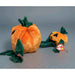 Two plush pumpkins, one large and one small, on a gray background.