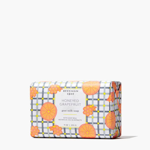 Bar of soap with honeyed grapefruit design on a white background