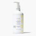  Pure conditioner in a clear bottle with a white pump, featuring a lemon design on the label.