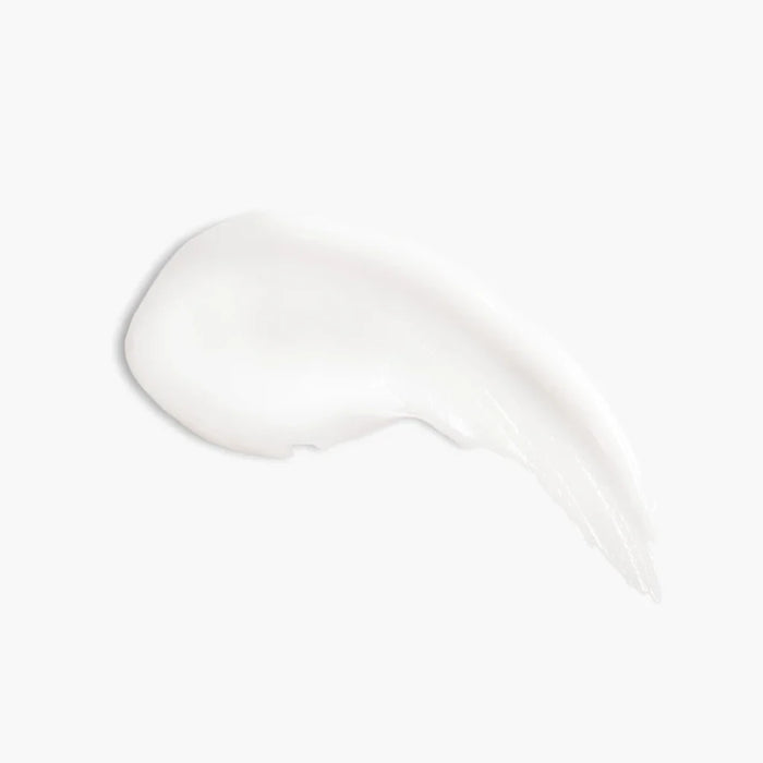 Clear bottle of pure conditioner with a white pump, adorned with a lemon graphic for a fresh touch.