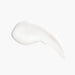 Clear bottle of pure conditioner with a white pump, adorned with a lemon graphic for a fresh touch.