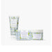 Body care set featuring a body scrub, body lotion, and body wash arranged neatly on a soft background.