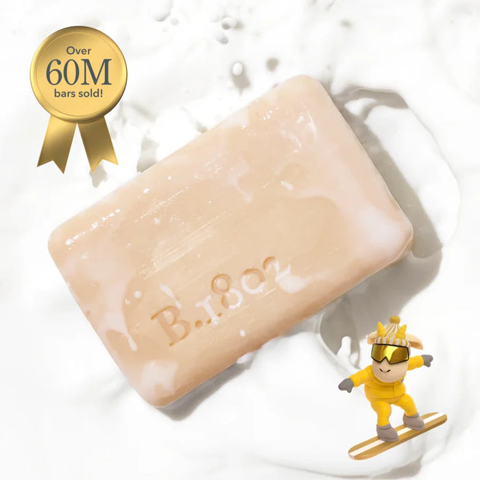 b-coo milk bar soap displayed on a wooden surface, showcasing its smooth texture and simple, elegant design.