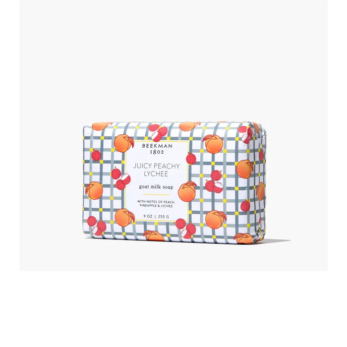 A soap bar featuring a vibrant orange and peach print design on its surface.