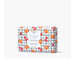 A soap bar featuring a vibrant orange and peach print design on its surface.