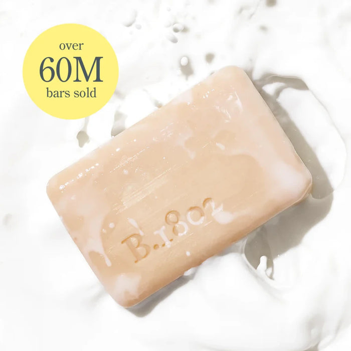 Body skin care routine with a bottle of liquid soap and two tubes of cream soap for cleansing and moisturizing.