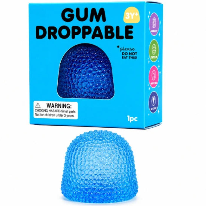 Blue translucent gumdrop-shaped sensory squeeze toy with a raised bumpy texture, shown in front of its turquoise packaging.