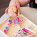 A craft kit designed for making a princess wand, complete with vibrant supplies and easy-to-follow instructions.