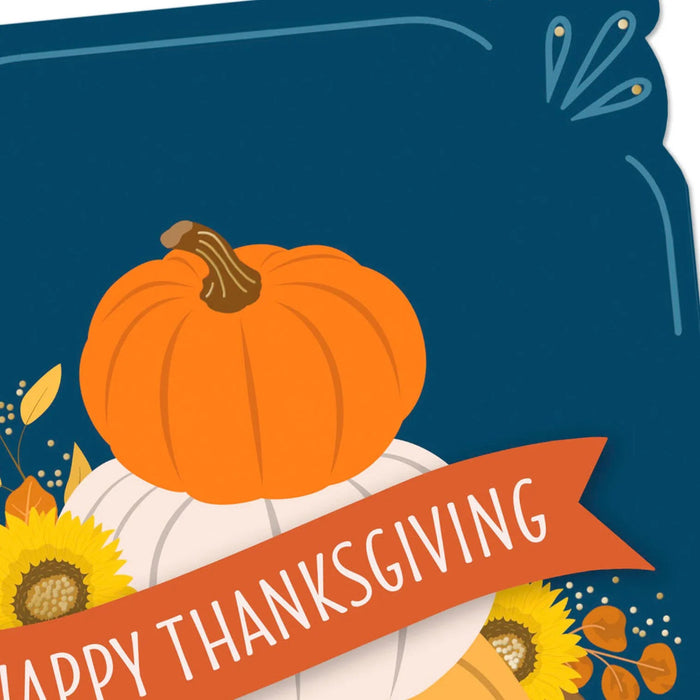 Premium Thanksgiving greeting card with blue background, pumpkins, and autumn leaves
