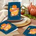 Premium Thanksgiving greeting card with blue background, pumpkins, and autumn leaves
