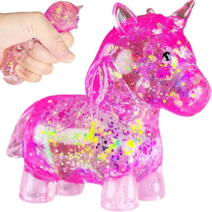 Pink unicorn toy with glittery texture and small pink unicorn figurine held by a hand.