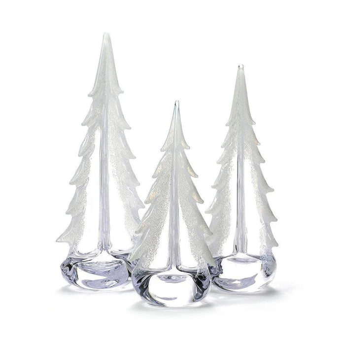 Simon Pearce Vermont Snowy Branches glass evergreen with frosted white branches, displayed beside glass pumpkins and lights.