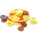 A colorful stack of wooden blocks displaying various fruits and chocolate, creatively arranged for visual appeal.