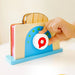 A wooden toy toaster featuring a knife, a piece of bread, and butter, perfect for pretend play.